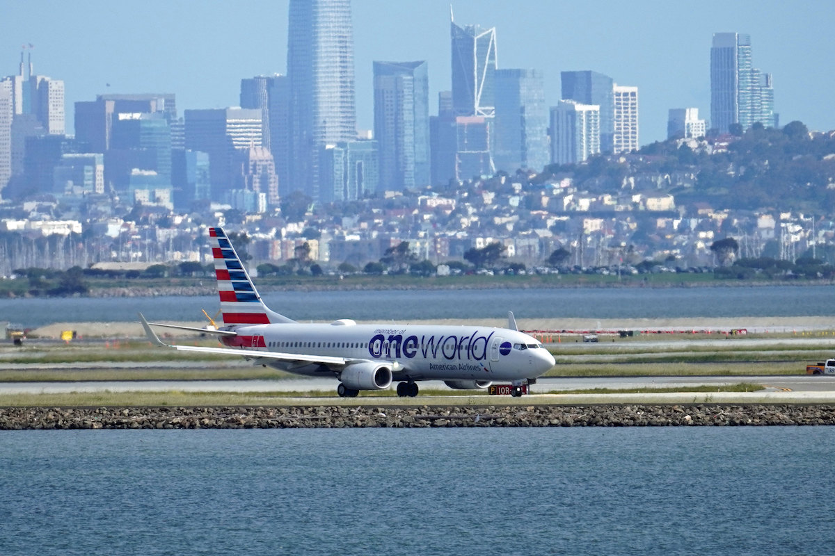 An American Airlines Boeing 737 taxis with the San Francisco skyline in the background. (Luke Lai/Flickr) 