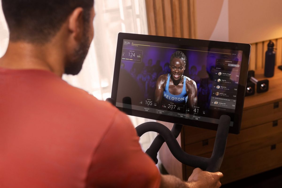 A person riding a Peloton fitness machine. Source: Peloton.