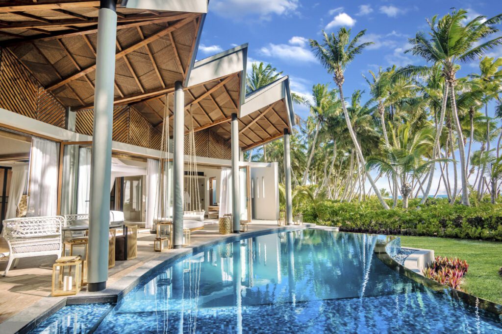 A view of the pool and guest room balconies at the Waldorf Astoria Seychelles Platte Island, which opened in January 2024